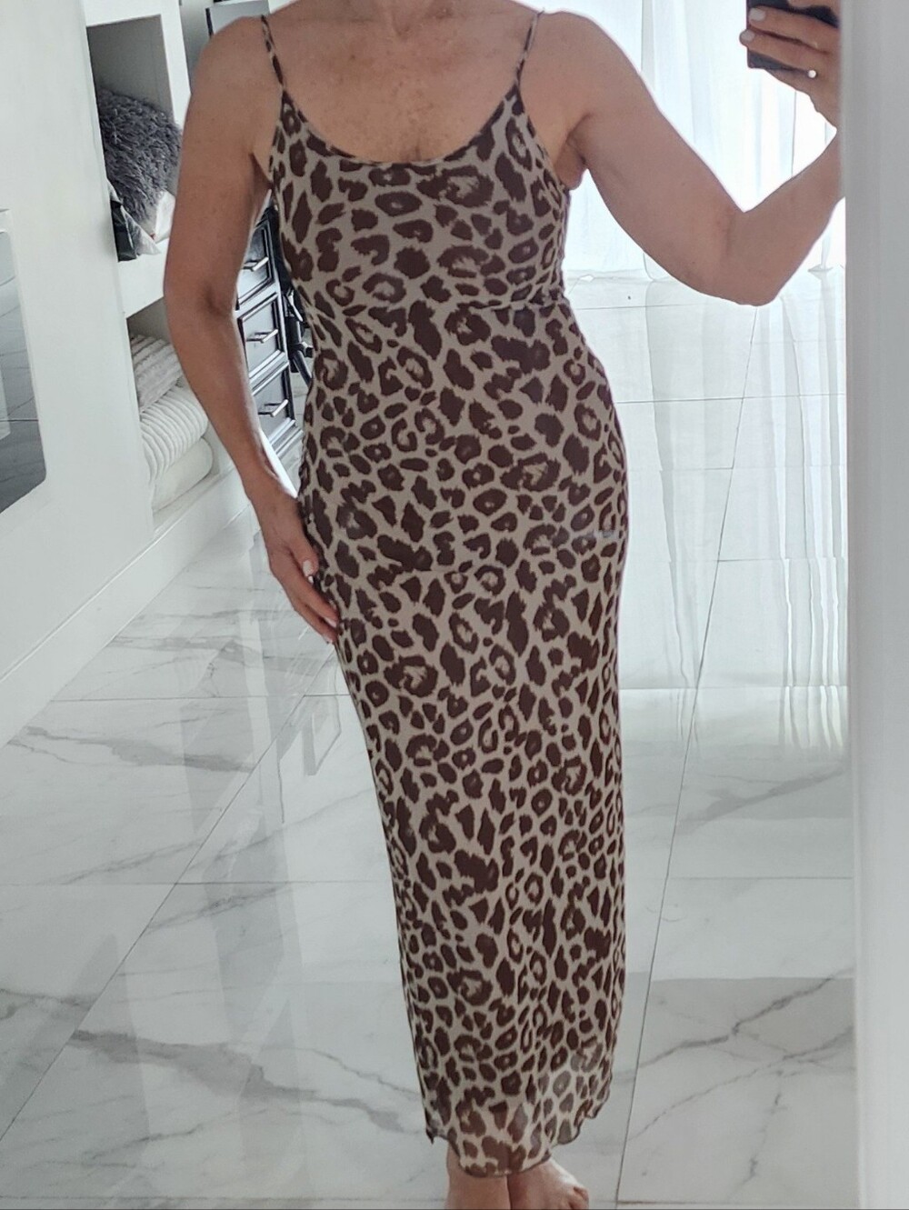 Sexy leopard print spaghetti strap.Long dress below the knee